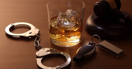 handcuff, alcohol, car keys, and gavel