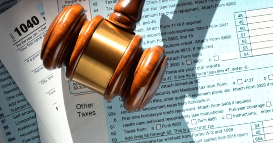 tax form with gavel